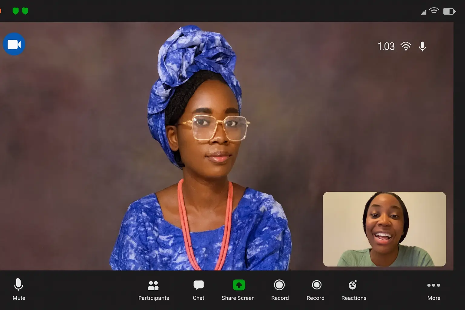 Yoruba language tutor in traditional attire teaching a student during an online video call session.